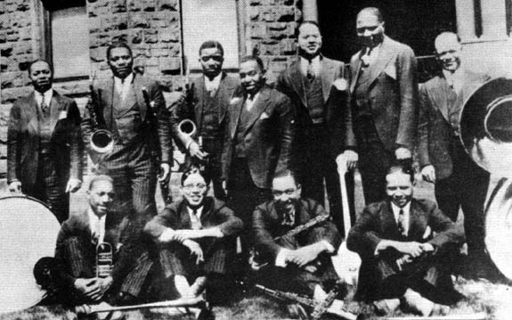 McKinney's Cotton Pickers in 1928. left to right: Cuba Austin, Prince Robinson, George Thomas, Don Redman, Dave Wilborn, Todd Rhoades, Bob Escudero, seated: John Nesbitt, Claude Jones, Milton Senior, Langston Curl. Care of redhotjazz.com